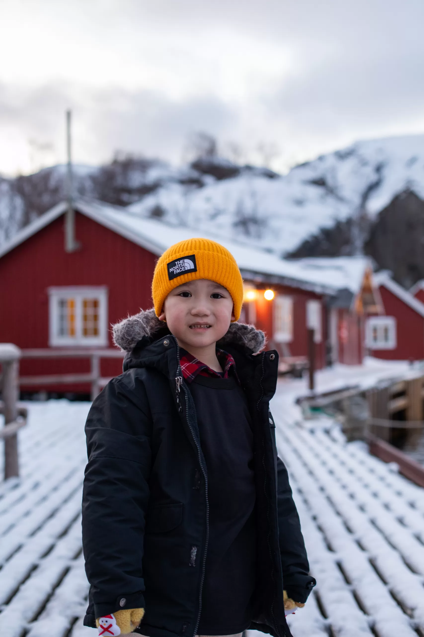 child-yellow-beanie-lofoten-village